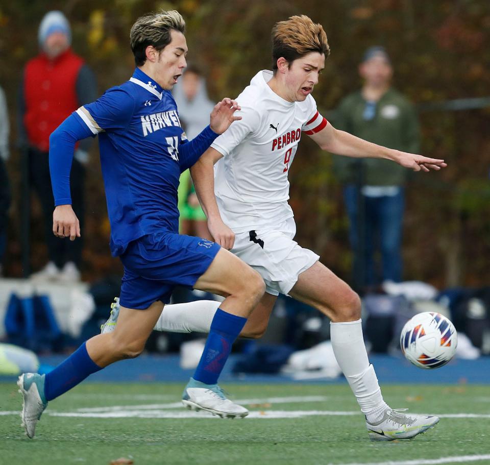 Wil McManus of Pembroke keeps one step ahead of Norwell's Joshua Kue during the Div. 3 boys soccer state final at Scituate High on Saturday, Nov. 18, 2023. Norwell won in a penalty kick shootout.