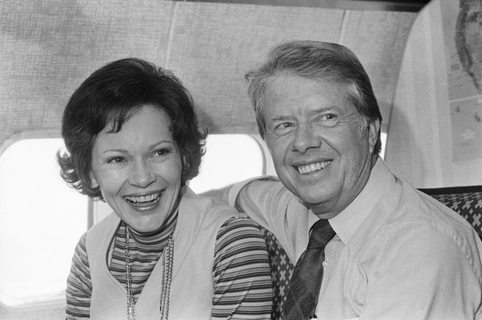 Jimmy Carter and his wife, Rosalynn, share a moment aboard his campaign plane in October 1976. / Credit: Bettmann via Getty Images