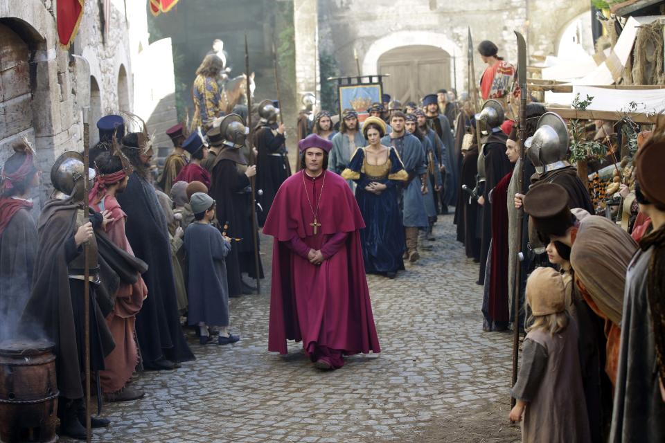 In this photo taken Monday, Oct. 29, 2012, actors perform during the shooting of "Borgia" tv series in Sermoneta, Italy. The Italian economy may be struggling but the pan-European television series “Borgia,” which is now filming its second season in Italy, is a thriving hit on the world market. Spanning the late Middle Ages to the early Renaissance period, the show follows the famous Borgia family's rise to power and subsequent domination of the Vatican and southern Europe's political landscape. A winning combination of sex, violence, faith, lust and betrayal, the primarily French-German production has been sold in 85 countries worldwide. (AP Photo/Gregorio Borgia)