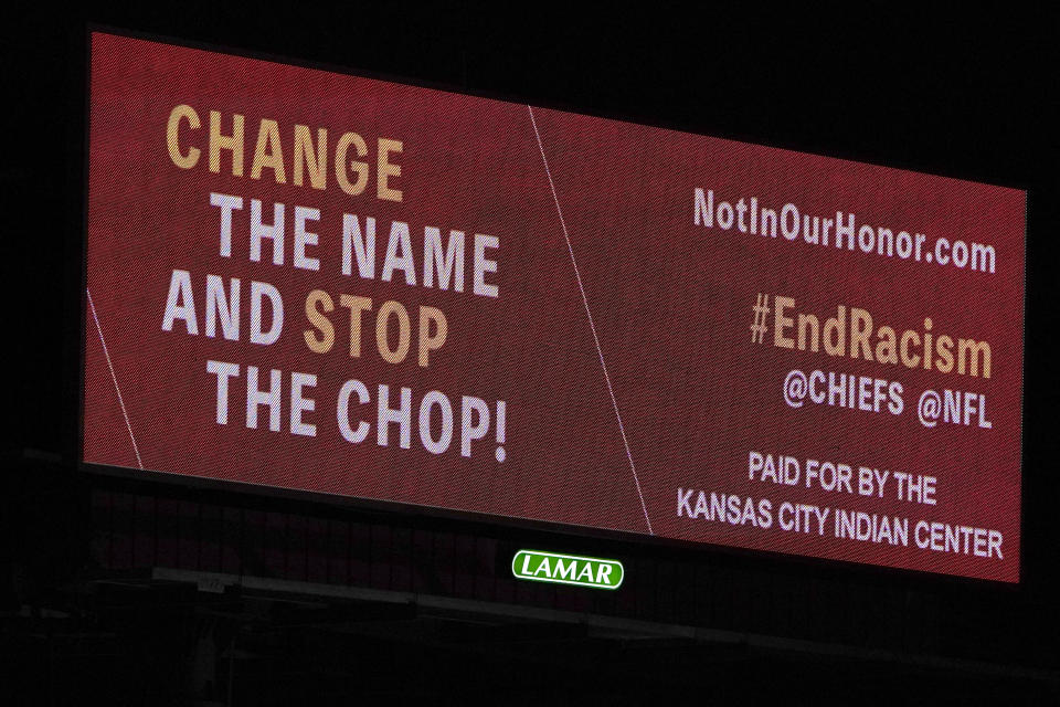 FILE - A billboard calling for a name change and an end to the Kansas City Chiefs "chop" stands along Interstate 70 in Kansas City, Mo., Wednesday, Feb. 3, 2021. Rhonda LeValdo and dozens of other Indigenous activists from Kansas City and around the country are gathering this weekend in Las Vegas ahead of Sunday’s game to demand that the Kansas City Chiefs change their name, the fan-driven “tomahawk chop” and retire “any and all Native American appropriation owned and used by the team,” according to a statement by Not In Our Honor, the group LeValdo founded and leads. (AP Photo/Orlin Wagner, File)