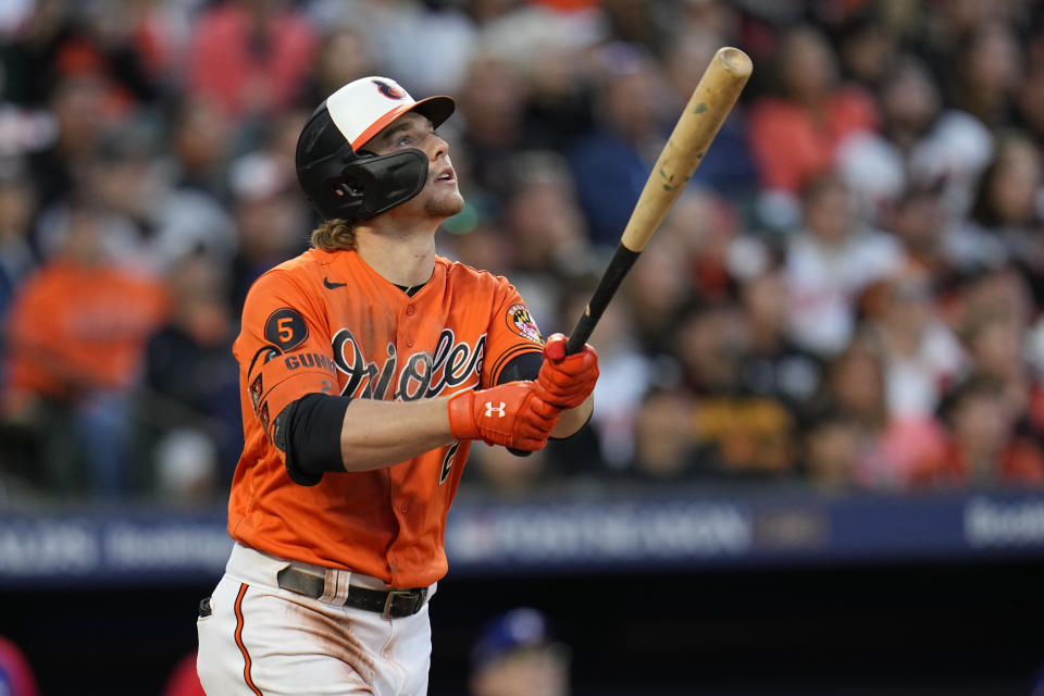 Baltimore Orioles' Gunnar Henderson looks after his solo home run during the fifth inning in Game 2 of an American League Division Series baseball game against the Texas Rangers, Sunday, Oct. 8, 2023, in Baltimore. (AP Photo/Julio Cortez)