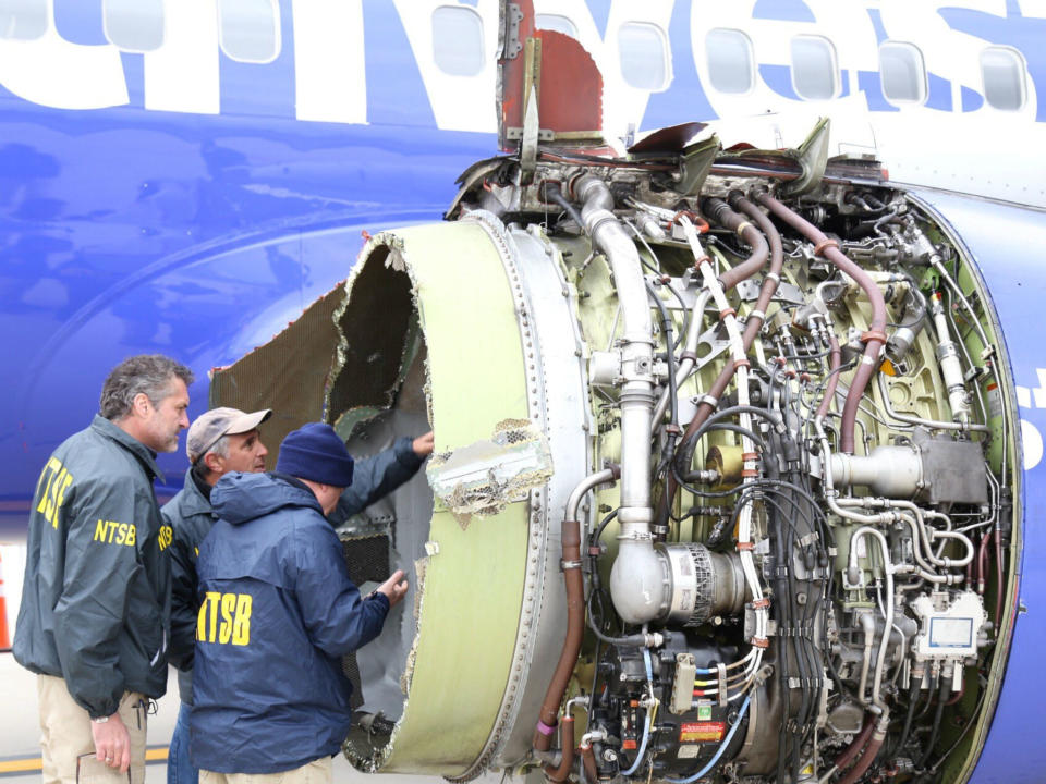 Investigators examine damage to the engine of the Southwest Airlines plane: NTSB/Handout