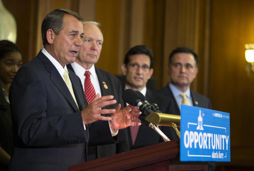 Speaker of the House Rep. John Boehner, R-Ohio, speaks during a news conference supporting charter schools on Capitol Hill, on Wednesday, May 7, 2014, in Washington, as from left, Rep. John Kline, R-Minn., Rep. Eric Cantor, R-Va., and Rep. Luke Messer, R-Ind., listen. (AP Photo/ Evan Vucci)