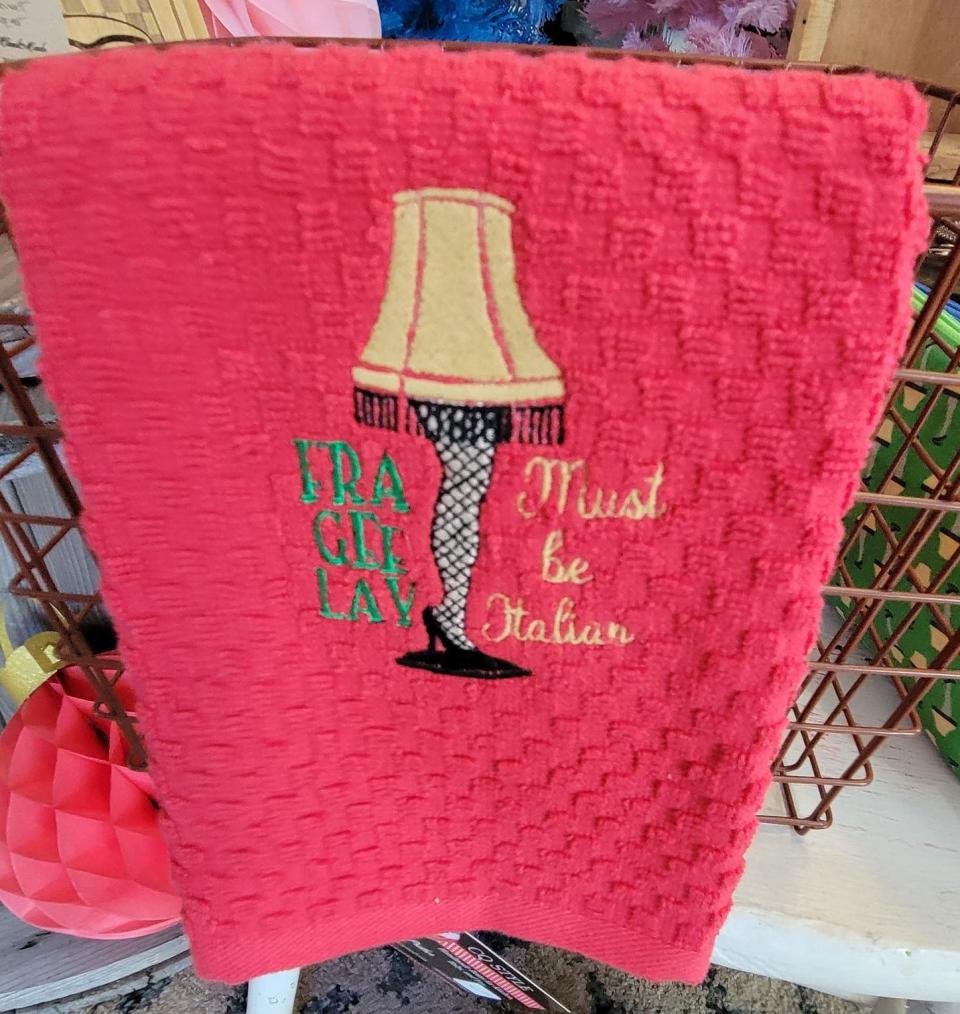 A wide variety of merchandise inspired by the 1983 movie "A Christmas Story" and created by Oklahoma artists, including hand towels, is for sale at the Downtown Mercantile and Visitors Center in downtown Chickasha.