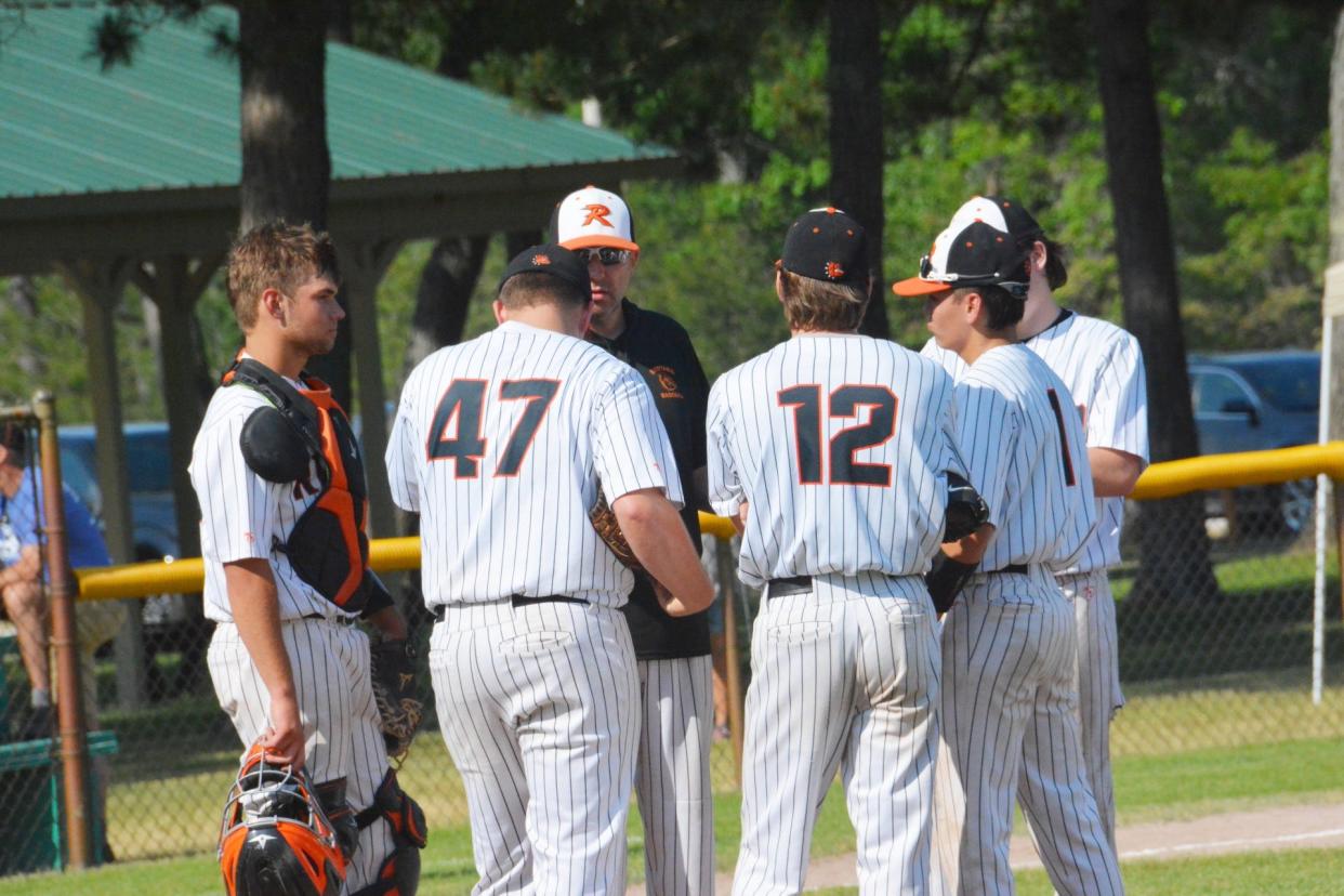 Rudyard coach Billy Mitchell makes a mound visit during a regional tournament game last season. The Rudyard baseball team returns a veteran-led group for the 2022 spring season.