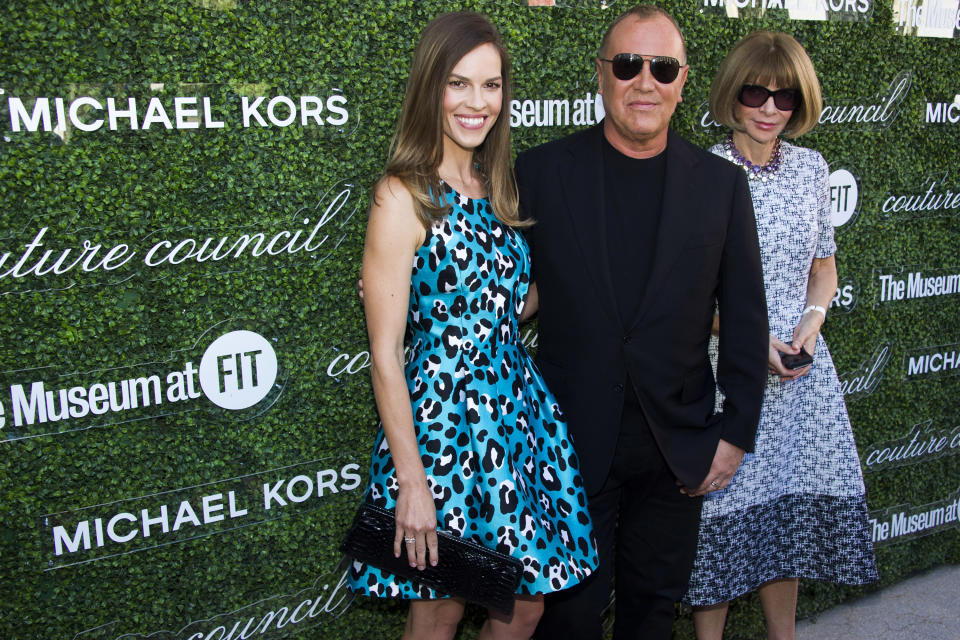 Actress Hilary Swank, from left, designer Michael Kors and Anna Wintour arrive at the 2013 Couture Council Award Luncheon at Lincoln Center on Wednesday, Sept. 4, 2013 in New York. (Photo by Charles Sykes/Invision/AP)