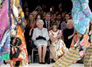 Britain's Queen Elizabeth II sits next to Vogue Editor-in-Chief Anna Wintour and Caroline Rush, Chief Executive of the British Fashion Council, and royal dressmaker Angela Kelly as they view Richard Quinn's runway show before presenting him with the inaugural Queen Elizabeth II Award for British Design as she visits London Fashion Week, in London, Britain February 20, 2018. REUTERS/Yui Mok/Pool