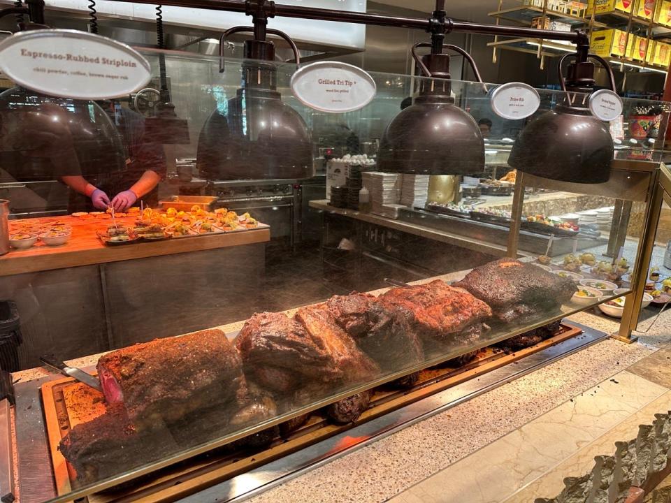 Stacks of meats at a carving station in Bacchanal buffet