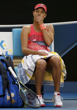 Serbia's Ana Ivanovic reacts as she sits in her chair while her coach Nigel Sears receives medical attention, causing a delay in play during her third round match against Madison Keys of the U.S. at the Australian Open tennis tournament at Melbourne Park, Australia, January 23, 2016. REUTERS/Issei Kato