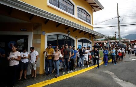 People wait to cast their votes during an unofficial plebiscite against Venezuela's President Nicolas Maduro's government, in San Jose, Costa Rica July 16,2017. REUTERS/Juan Carlos Ulate