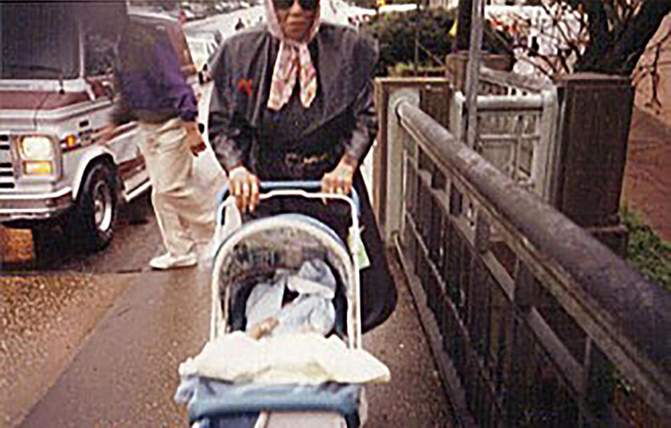 This image provided by Elliott Smith shows civil rights activist Amelia Boynton pushing her great-nephew Elliott Smith in a stroller near the Edmund Pettus Bridge in Selma, Ala, during a 1995 commemoration of the Selma to Montgomery voting rights marches. Now, at 27, Smith is in Selma leading a multiracial delegation of millennial and Gen Z activists, carrying on the legacy of the movement’s original foot soldiers. (Elliott Smith via AP)