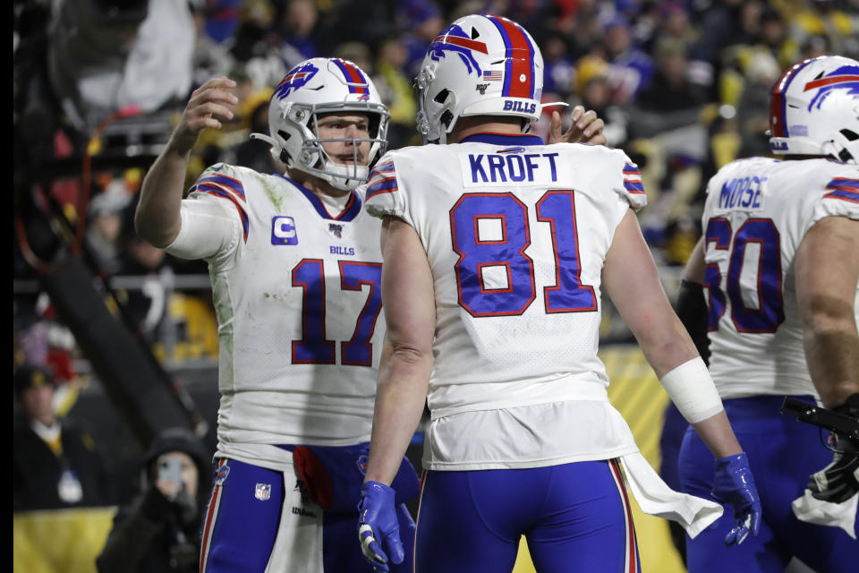 Buffalo Bills quarterback Josh Allen (17) celebrates after throwing a touchdown pass to tight end Tyler Kroft (81) during the second half of an NFL football game against the Pittsburgh Steelers in Pittsburgh, Sunday, Dec. 15, 2019. (AP Photo/Don Wright)