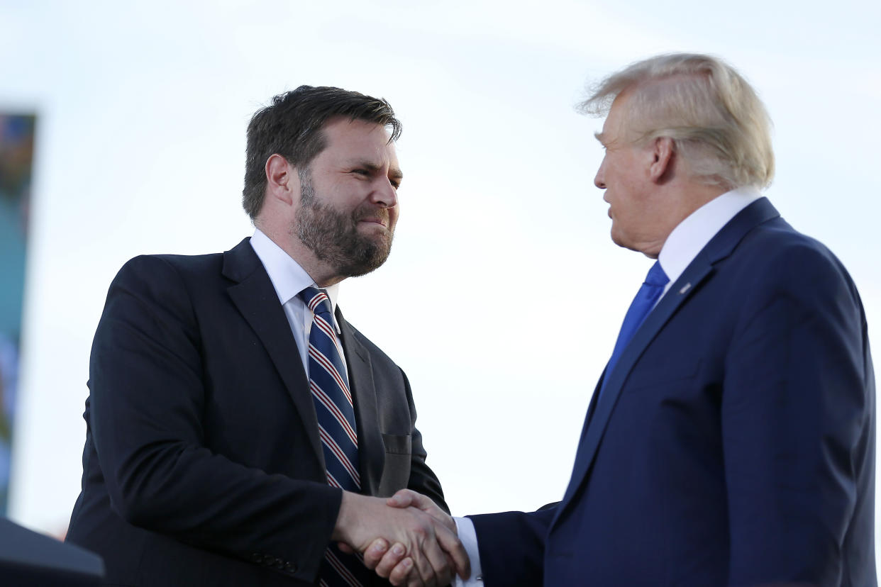 Senate candidate JD Vance, left, greets former President Donald Trump at a rally at the Delaware County Fairground, April 23, 2022, in Delaware, Ohio, to endorse Republican candidates ahead of the Ohio primary on May 3. (Joe Maiorana/AP)