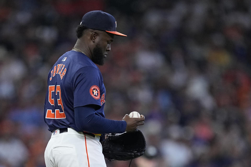 Houston Astros starting pitcher Cristian Javier walks off the mound after giving up a solo home run to Texas Rangers' Evan Carter during the fourth inning of a baseball game against the Houston Astros Sunday, April 14, 2024, in Houston. (AP Photo/Kevin M. Cox)