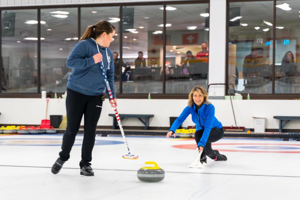 TV travel host Samantha Brown, right, gets some pointers in the art of curling from Olympian Becca Hamilton in an episode of "Samantha Brown's Places to Love" featuring Madison, Wisconsin.