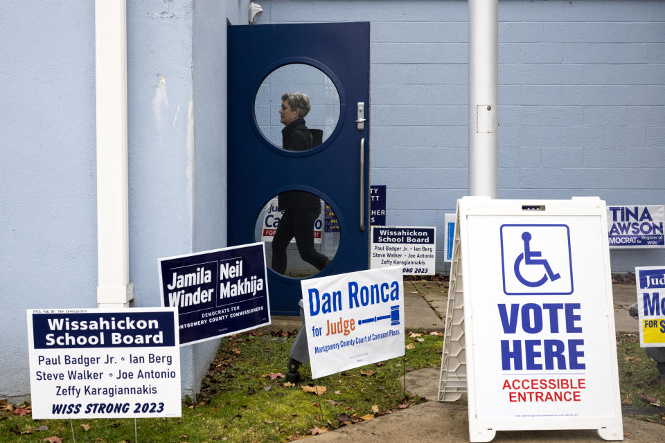 A voter enters the Wissahickon Valley Public Library in Blue Bell, Pa. on Tuesday, Nov. 7, 2023. (AP Photo/Joe Lamberti)