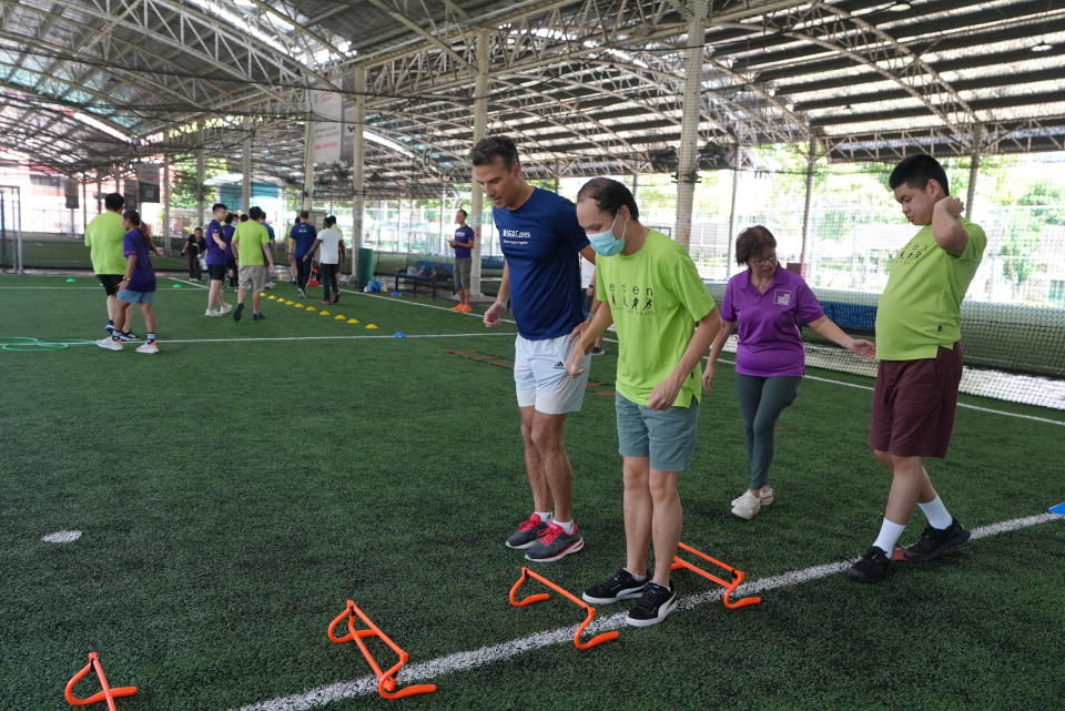 SGX Cares sports workshop with Autism Association Singapore at Kick Off at Kovan. (PHOTO: SGX Cares)