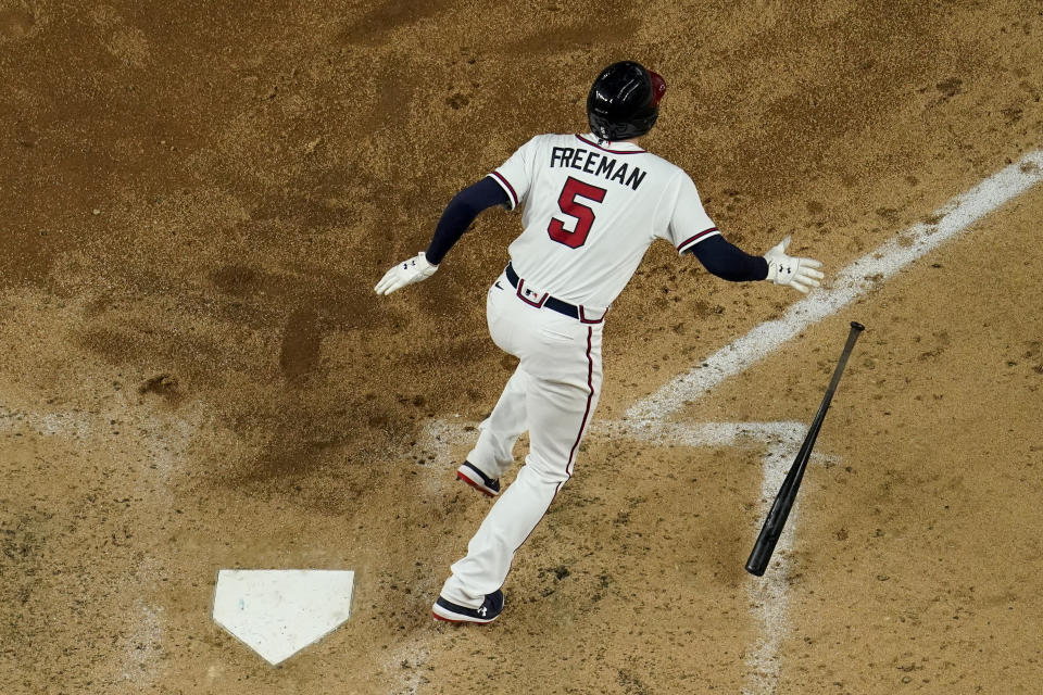 Atlanta Braves' Freddie Freeman watches his RBI-double against the Los Angeles Dodgers during the sixth inning in Game 4 of a baseball National League Championship Series Thursday, Oct. 15, 2020, in Arlington, Texas. (AP Photo/David J. Phillip)