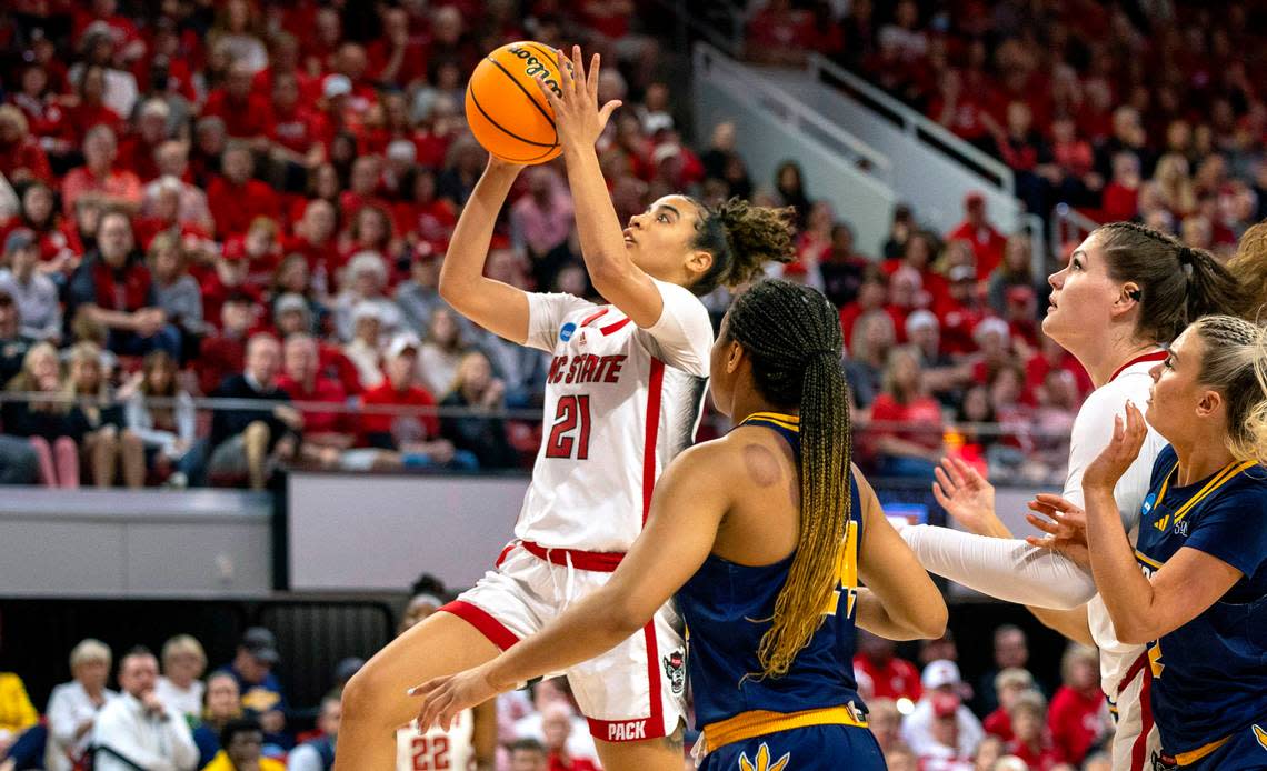 NC State’s Madison Hayes (21) drives to the basket during the first half of their game against Chattanooga in the first round of the NCAA Division I Women’s Basketball Championship at Reynolds Coliseum in Raleigh, NC on Saturday, March 23, 2024.