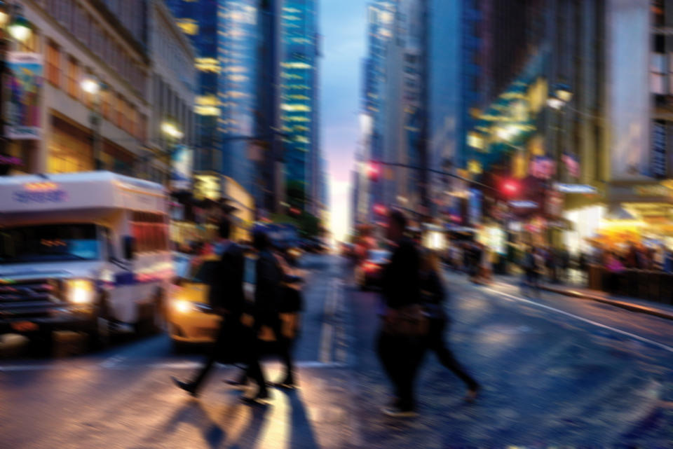 people crossing a busy street