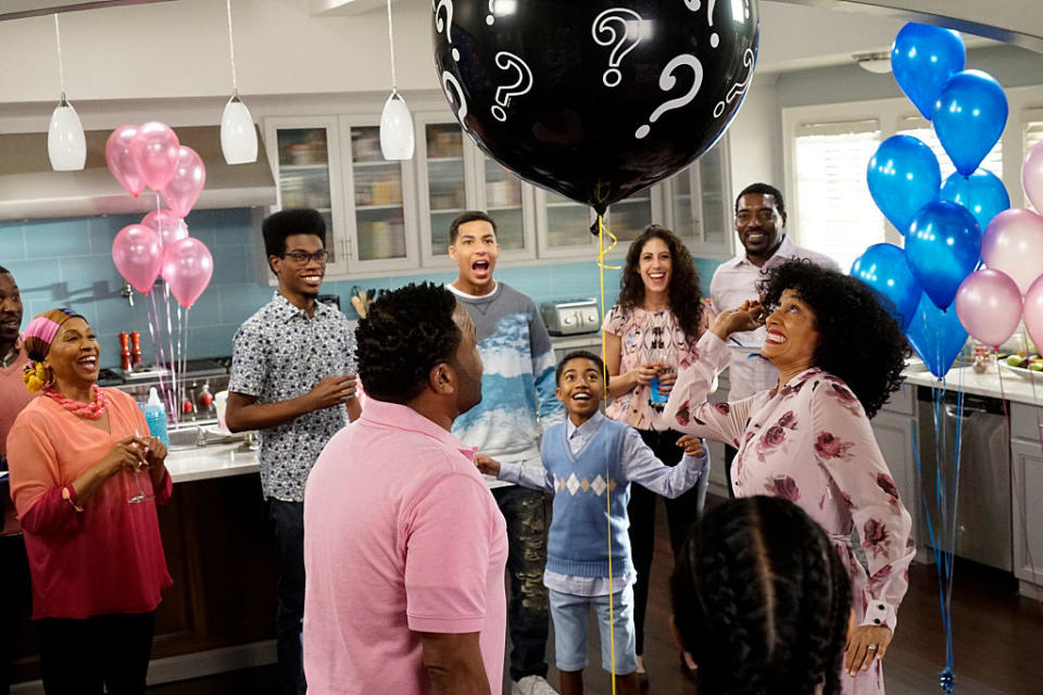 Johan Johnson, Bella Perez, Marcus Lee, Ryan Smith, Leah Bloom, Richard Davis, Carla Moore, and Michael Johnson gather in a kitchen for a gender reveal with balloons