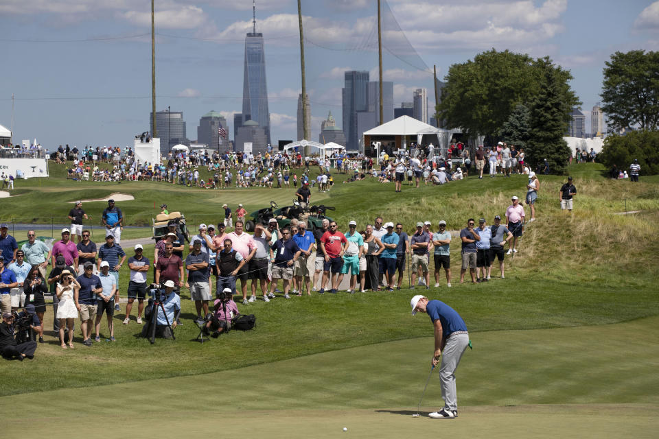 Brandt Snedeker putts on the third hole in the final round of the Northern Trust golf tournament at Liberty National Golf Course, Sunday, Aug. 11, 2019 in Jersey City, N.J. (AP Photo/Mark Lennihan)