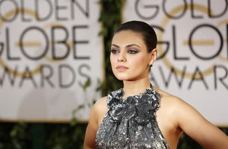 Actress Mila Kunis arrives at the 71st annual Golden Globe Awards in Beverly Hills, California January 12, 2014. REUTERS/Mario Anzuoni