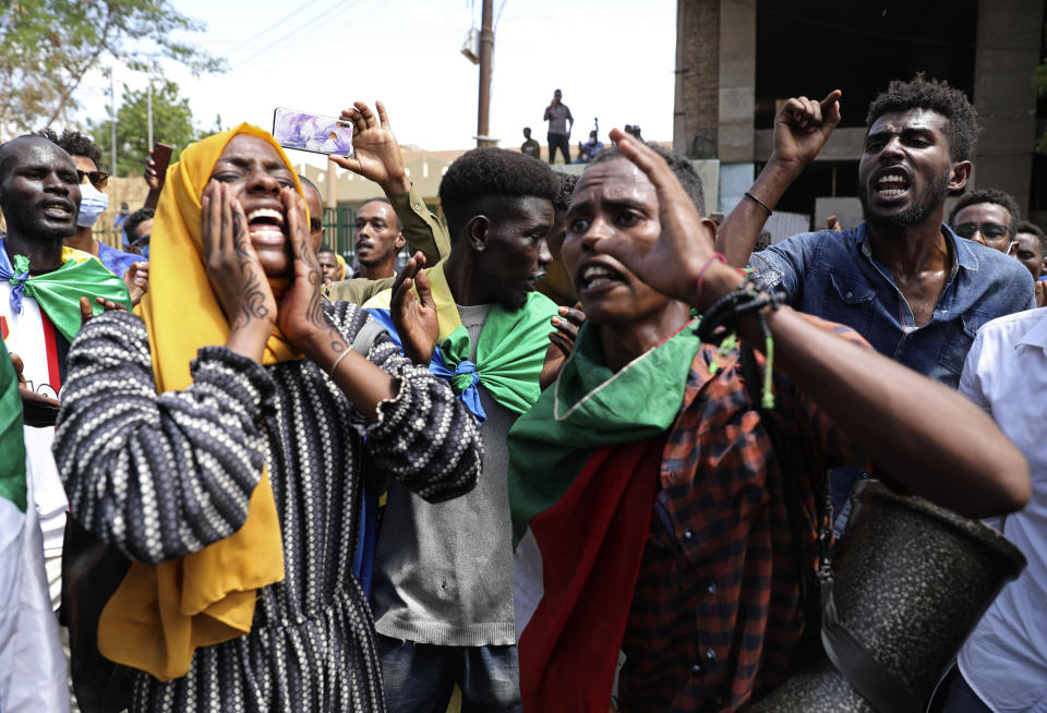 Sudanese protesters gather outside the Cabinet’s headquarters in the capital, Khartoum, Sudan, Monday, Aug. 17, 2020. Protesters returned to the streets Monday to pressure transitional authorities for more reforms, a year after a power-sharing deal between the pro-democracy movement and the generals. (AP Photo/Marwan Ali)