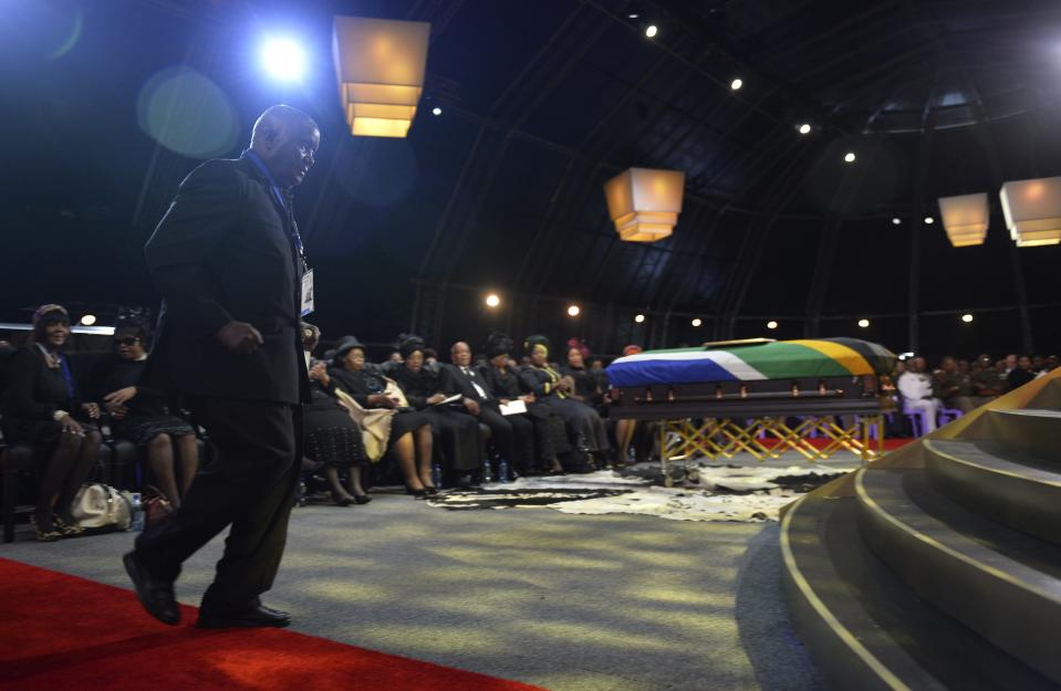 Former President of Zambia Kenneth Kaunda walks to the stage to speak during the funeral ceremony for former South African President Nelson Mandela in Qunu