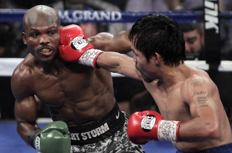 Manny Pacquiao (right) lands a blow on Timothy Bradley of the US during their WBO welterweight title fight on April 12, 2014 at the MGM Grand Garden Arena in Las Vegas, Nevada