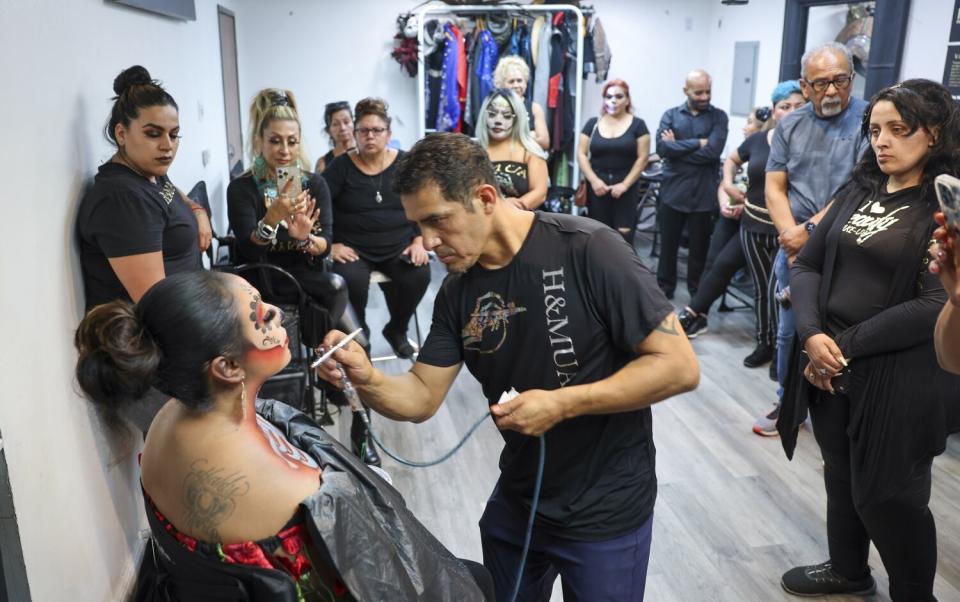 Ruben Lopez, senior artist and co-owner of H&MUA Studio, teaches a makeup school