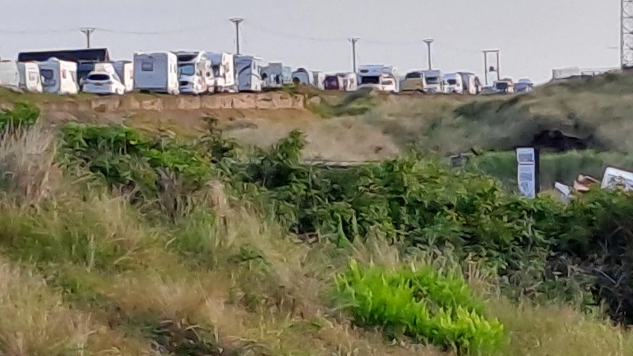 motorhomes and caravans parked along the road