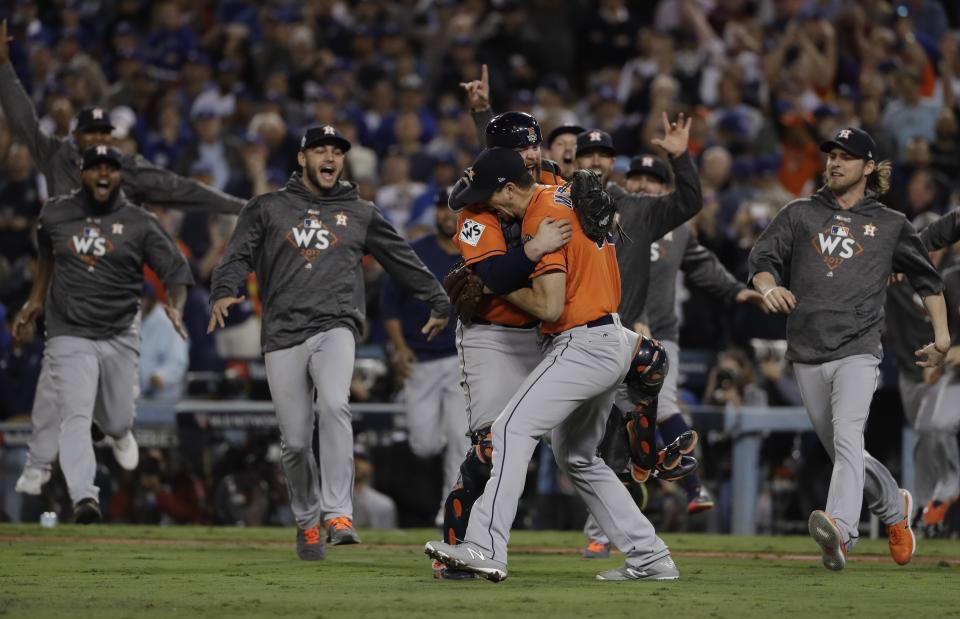 Andrew Watt maxed out his credit cards to go to every World Series game, and was rewarded with a Game 7 win. (AP Photo)