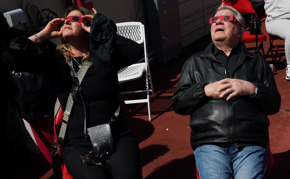 William Shatner watches the eclipse with Elizabeth Martin during the Hoosier Cosmic Celebration at Memorial Stadium on Monday, April 8, 2024.