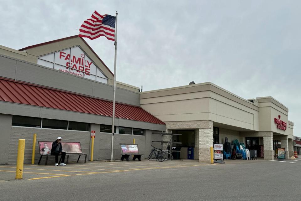 A woman created a small apartment out of a sign on top of a Family Dollar store in Michigan, police say