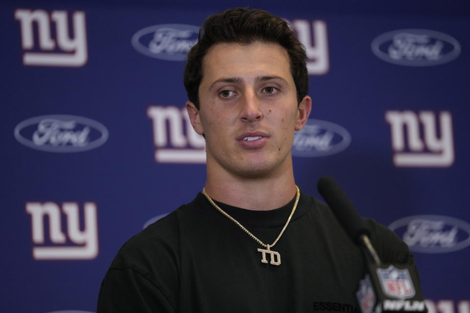 New York Giants quarterback Tommy DeVito speaks during a news conference after an NFL football game against the Dallas Cowboys, Sunday, Nov. 12, 2023, in Arlington, Texas. (AP Photo/Julio Cortez)