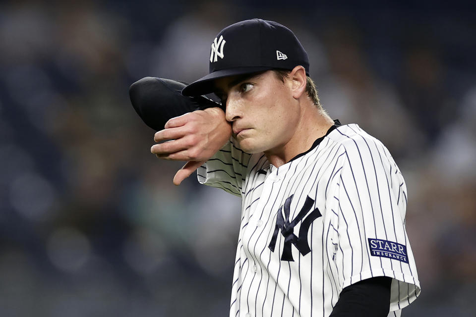 New York Yankees pitcher Ron Marinaccio reacts during the ninth inning of a baseball game against the Milwaukee Brewers, Saturday, Sept. 9, 2023, in New York. (AP Photo/Adam Hunger)