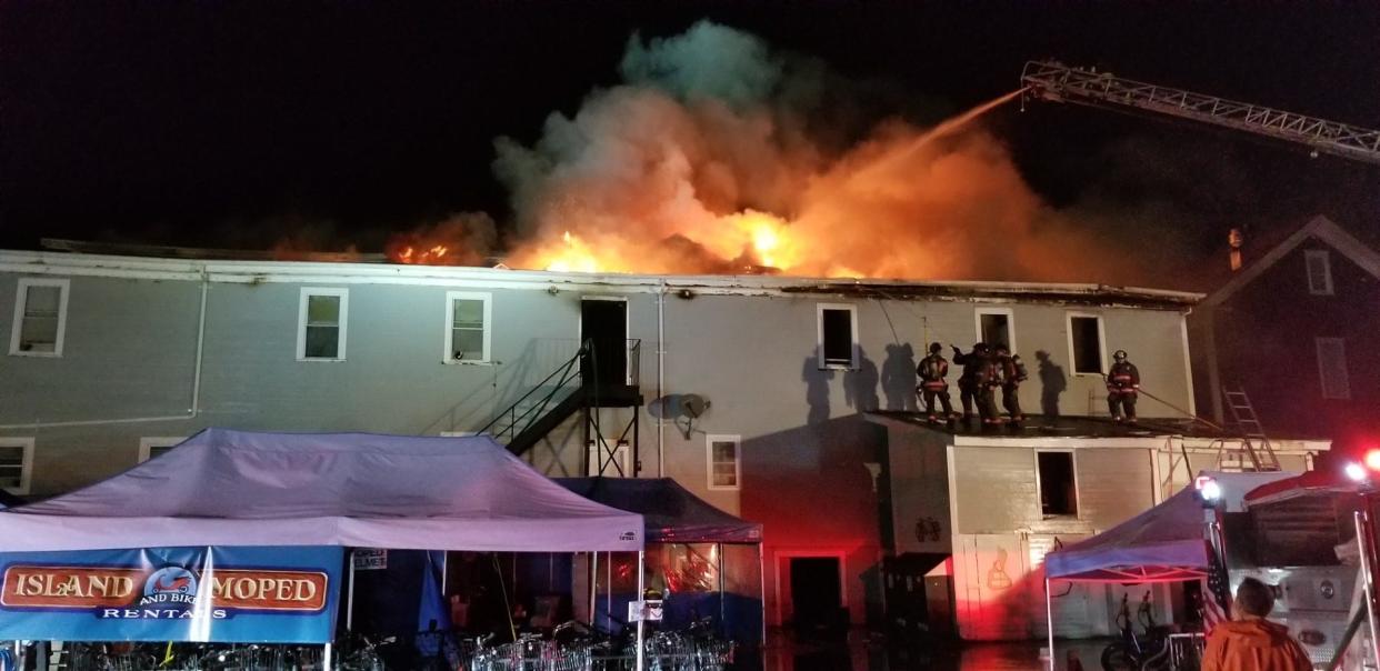 Firefighters work to extinguish the blaze at the historic Harborside Inn on Block Island that began the night of Aug. 18.