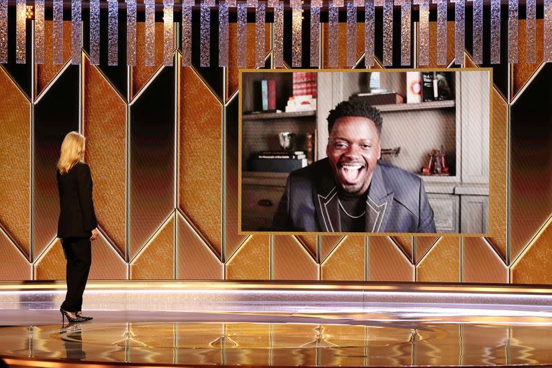 Actor Laura Dern presents the Best Supporting Actor Motion Picture award for “Judas and the Black Messiah” to winner Daniel Kaluuya in this handout photo from the 78th Annual Golden Globe Awards in Beverly Hills