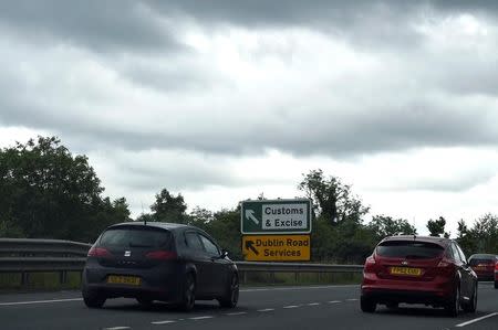 A sign for customs and excise is seen on the motorway approaching the border between Northern Ireland and Ireland, near Newry, Northern Ireland July 13, 2017. REUTERS/Clodagh Kilcoyne