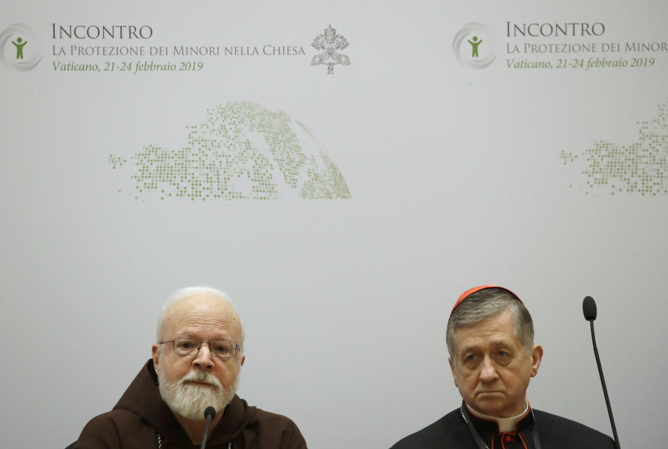 Cardinal Blase J. Cupich, Chicago Archbishop, right, and Cardinal Sean Patrick O'Malley, listen reporters' questions at a media briefing during a four-day sex abuse summit called by Pope Francis, in Rome, Friday, Feb. 22, 2019. (AP Photo/Alessandra Tarantino)