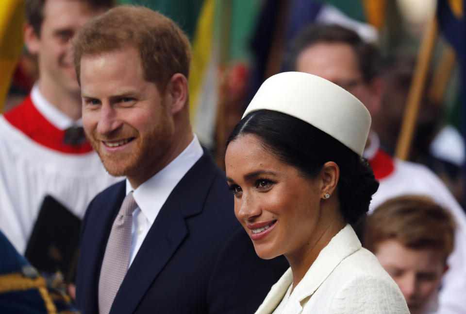 FILE - In this Monday, March 11, 2019 file photo, Britain's Prince Harry and Meghan, the Duchess of Sussex leave after the Commonwealth Service at Westminster Abbey in London. Prince Harry and Meghan Markle are to no longer use their HRH titles and will repay £2.4 million of taxpayer's money spent on renovating their Berkshire home, Buckingham Palace announced Saturday, Jan. 18. 2020. (AP Photo/Frank Augstein, file)