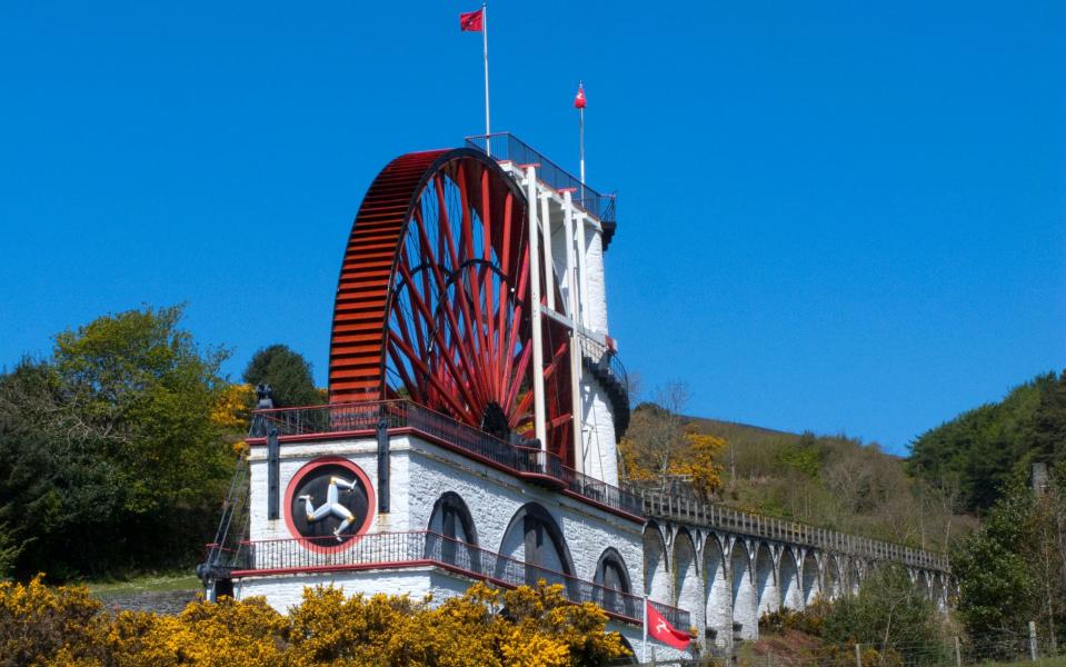 The striking bright-red water wheel at Laxey - Credit: ALAMY