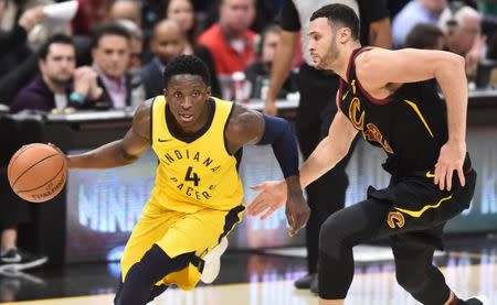 Apr 18, 2018; Cleveland, OH, USA; Indiana Pacers guard Victor Oladipo (4) drives to the basket against Cleveland Cavaliers forward Larry Nance Jr. (22) during the second half in game two of the first round of the 2018 NBA Playoffs at Quicken Loans Arena. Mandatory Credit: Ken Blaze-USA TODAY Sports