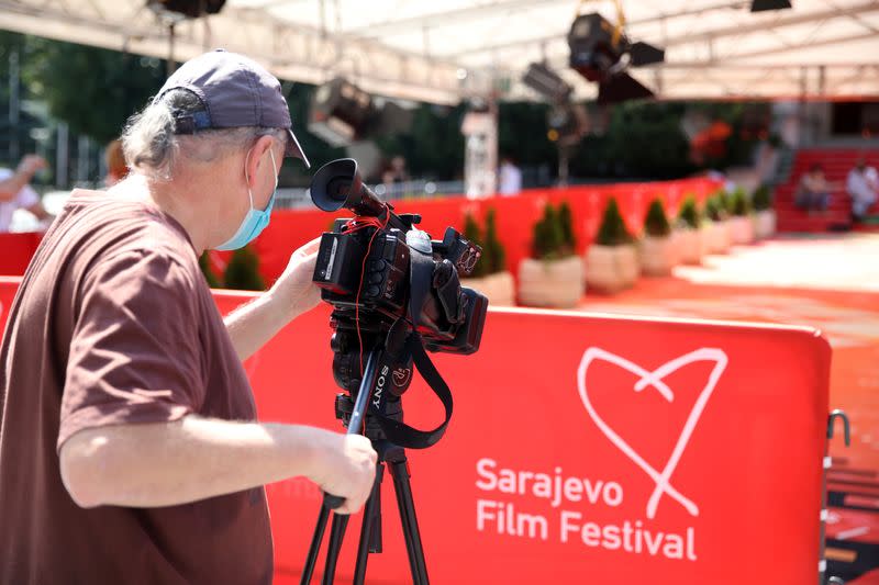 Cameraman records a red carpet before the online opening ceremony of the Sarajevo Film Festival in Sarajevo