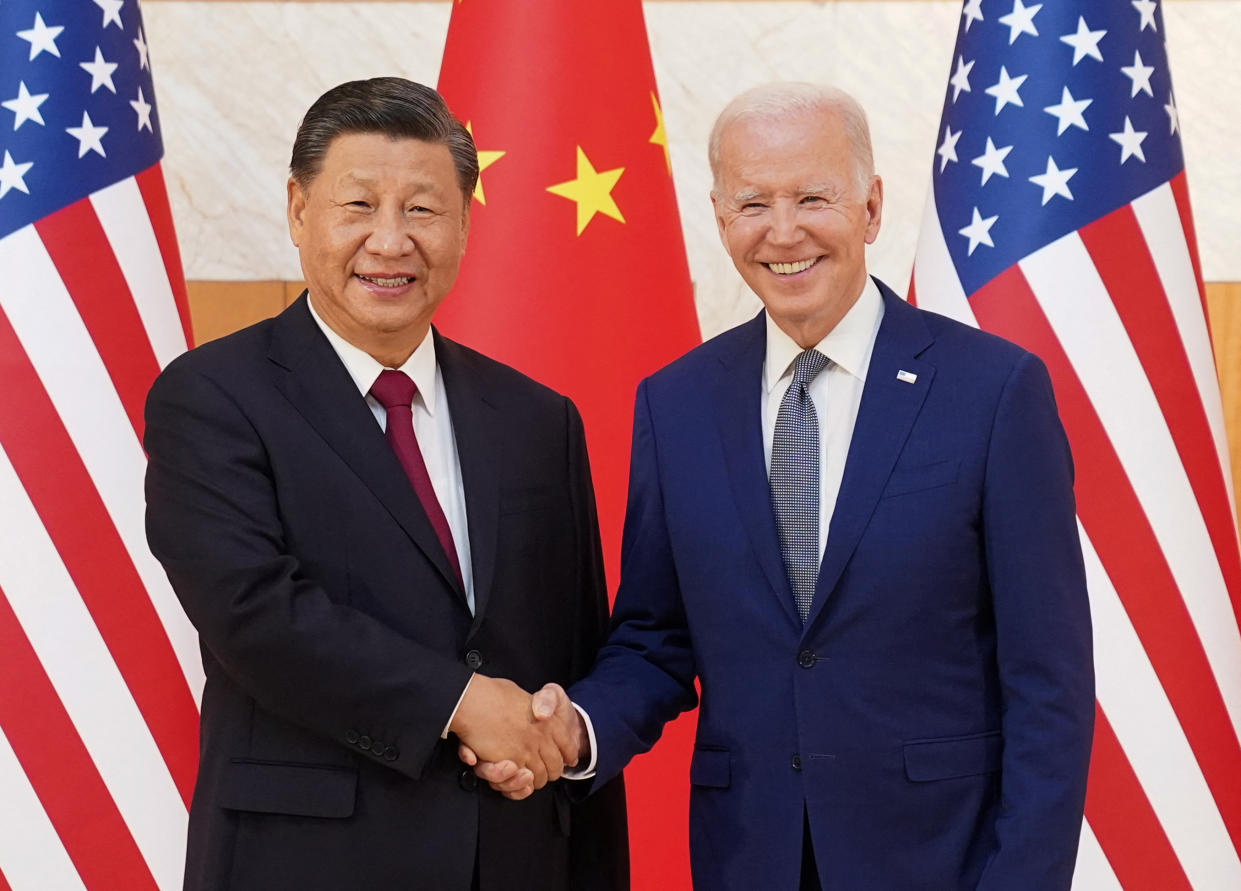 U.S. President Joe Biden shakes hands with Chinese President Xi Jinping as they meet on the sidelines of the G20 leaders' summit in Bali, Indonesia, November 14, 2022.  REUTERS/Kevin Lamarque