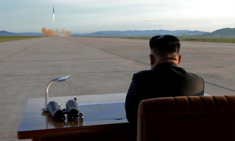 North Korean leader Kim Jong-un watches the launch of a Hwasong-12 missile in an undated photo released by the Korean Central News Agency in September.