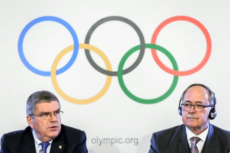 International Olympic Committee President Thomas Bach (L) and Chair of IOC Inquiry Commission into alleged Russian doping at Sochi 2014 Samuel Schmid address the media in Lausanne