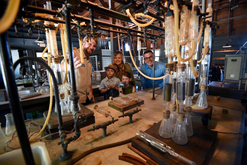 Chief Curator Brent Newman (left) shows off Thomas Edison's old laboratory at The Edison & Ford Winter Estates.