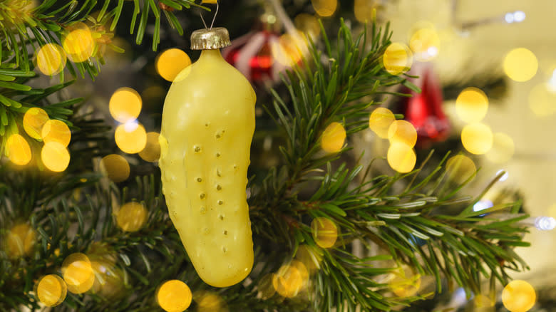 Christmas pickle ornament on tree 